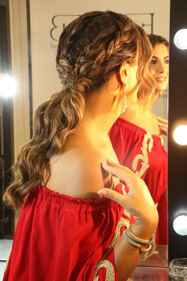 Textured braided ponytail with soft curled lengths